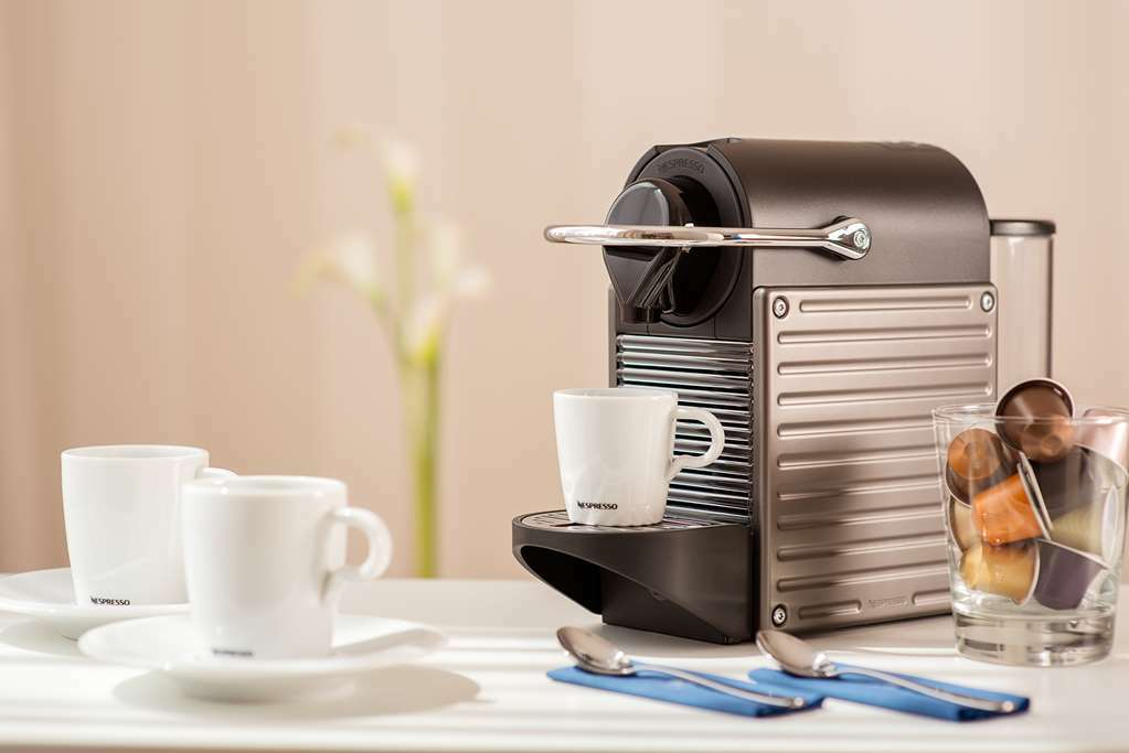 Nh Collection Eindhoven Centre Hotel Room photo A Nespresso inissia machine